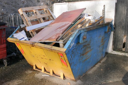 Movers packing items into a van in Chiswick